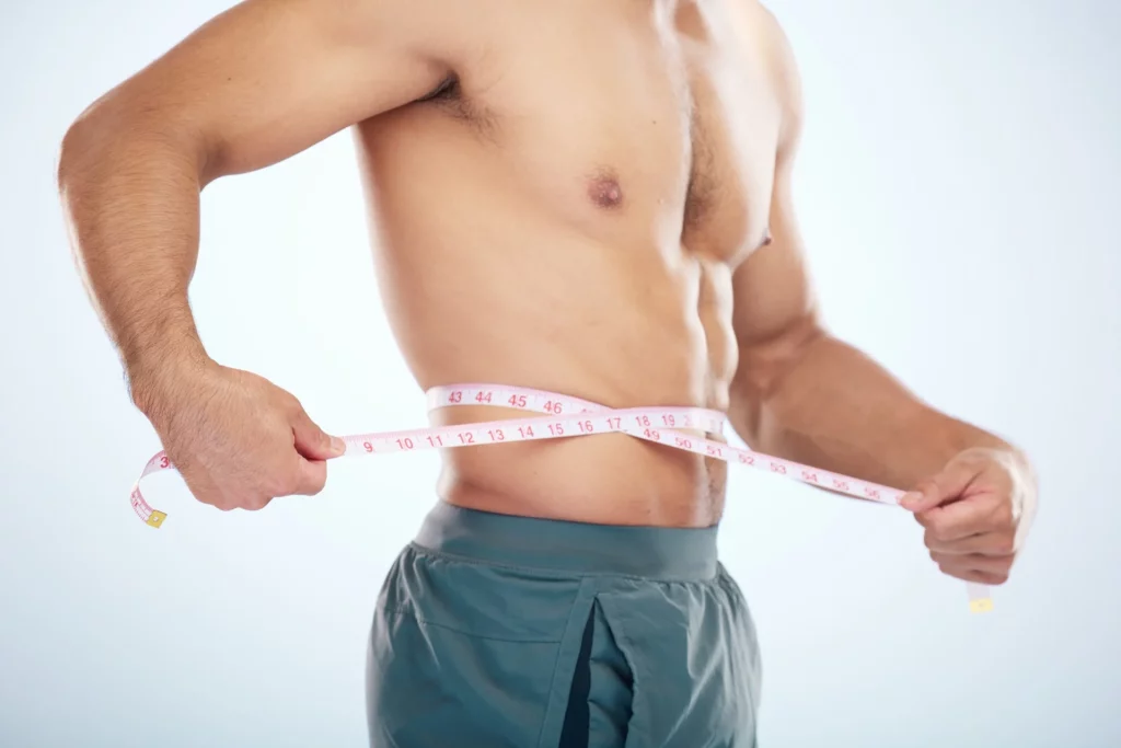 Man with measuring tape | Mesa Medical Health & Wellness | St. George, UT