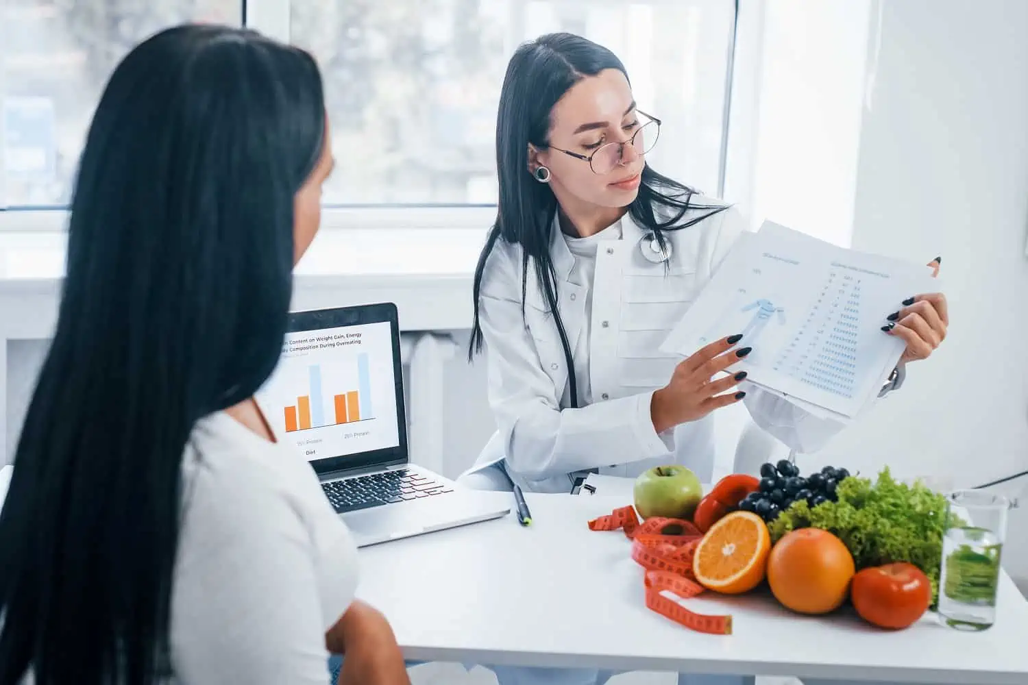 Doctor showing reports to patient | Mesa Medical Health & Wellness | St. George, UT