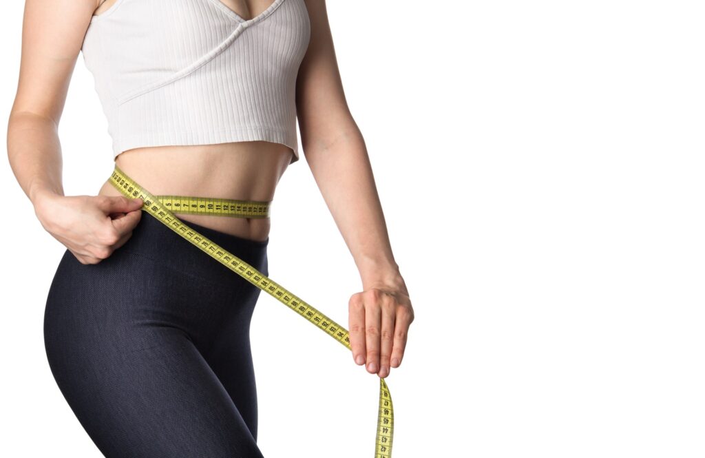 Woman measuring her body | Mesa Medical Health & Wellness | St. George, UT