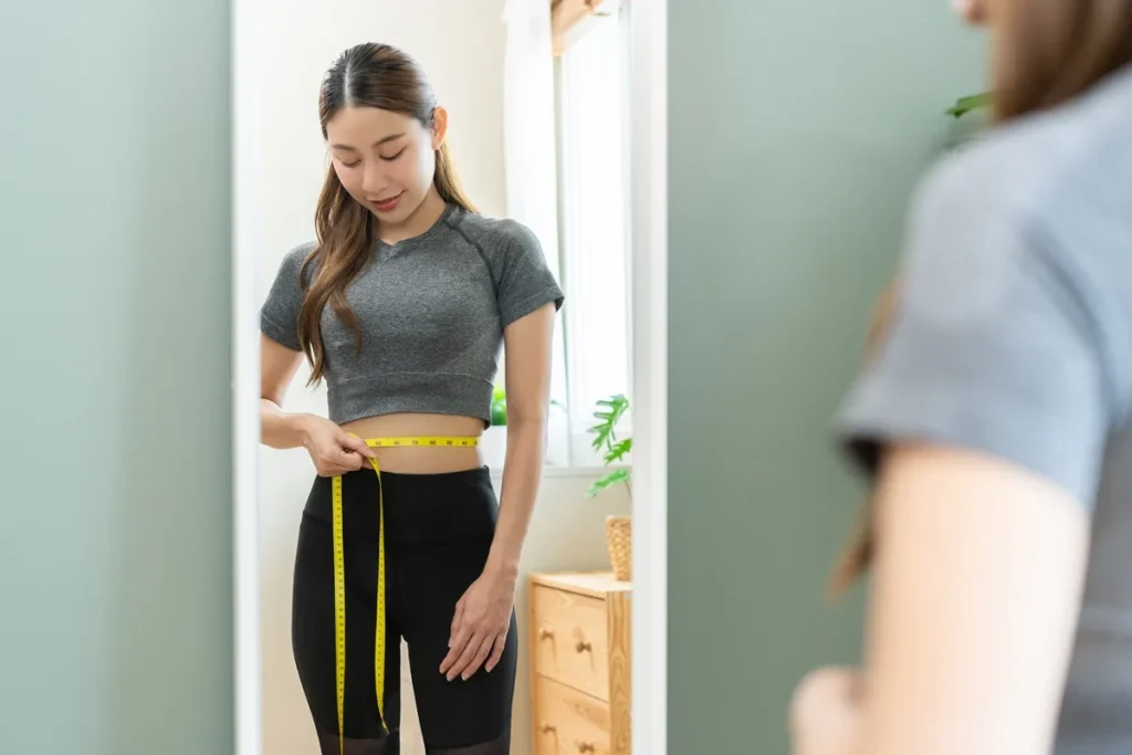 Smiling woman showcasing sustained weight loss results in St. George, UT