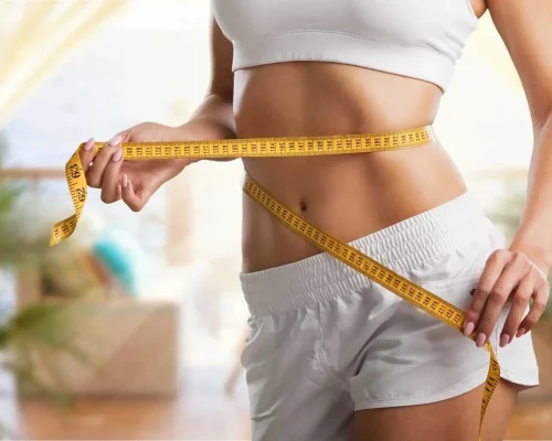 Measuring tape wrapped around waist | Mesa Medical Health & Wellness | St. George, UT