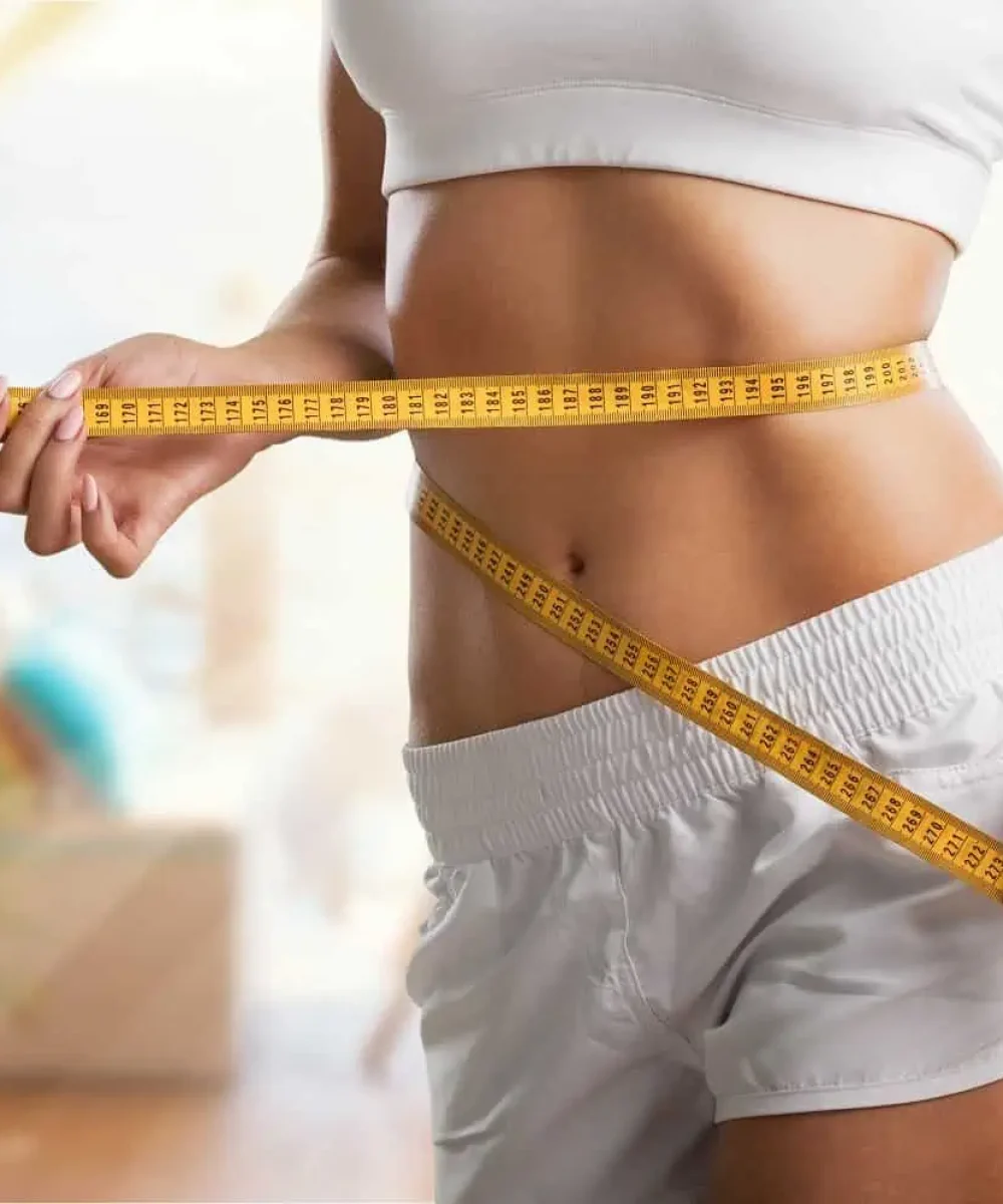 Measuring tape wrapped around waist | Mesa Medical Health & Wellness | St. George, UT